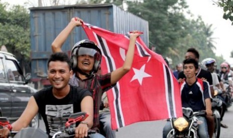 Sejumlah Mantan Kombatan Gerakan Aceh Merdeka (GAM) melakukan konvoi serepada motor membawa Bendera Aceh berlambang Bulan Bintang .