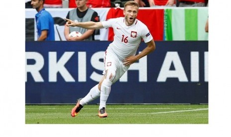 Selebrasi Jakub Blaszczykowski usai encetak gol. 