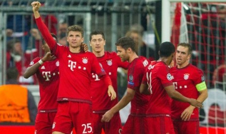 Selebrasi pemain Bayern Muenchen usai membobol gawang Arsenal.