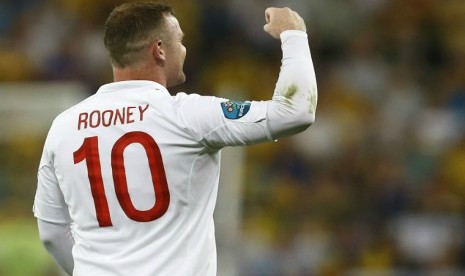  Selebrasi pemain Inggris Wayne Rooney usai mencetak gol ke gawang Ukrania. (Kirsty Wigglesworth/AP)