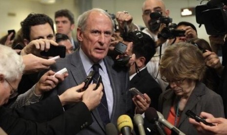 Senator Dan Coats (R-IN) talks to the media after former CIA Director David Petraeus testified at a Senate Intelligence Committee closed hearing on Capitol Hill in Washington, November 16, 2012.