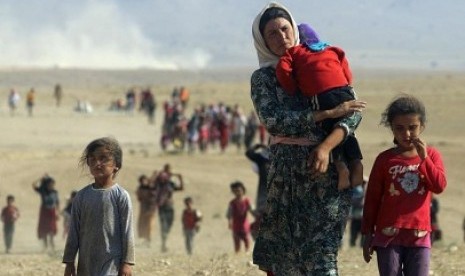 Seorang gadis 9 tahun hamil setelah disandera dan diperkosa oleh militan kelompok Negara Islam. Foto ini merupakan pengungsi dari Irak Yazidi yang dibebaskan ISIS sejak ditawan pada 11 Agustus 2014.