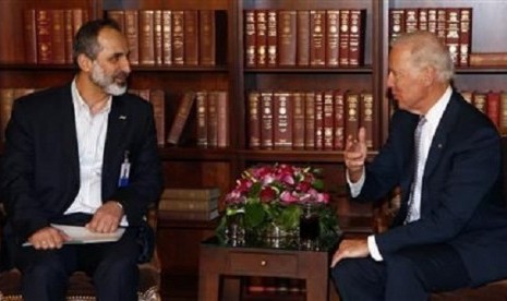 Sheikh Moaz Alkhatib, President of the National Coalition of Syrian Revolutionary and Opposition Forces and US Vice-President Joe Biden (right) meet for bilateral talks during the 49th Conference on Security Policy in Munich February 2, 2013. 