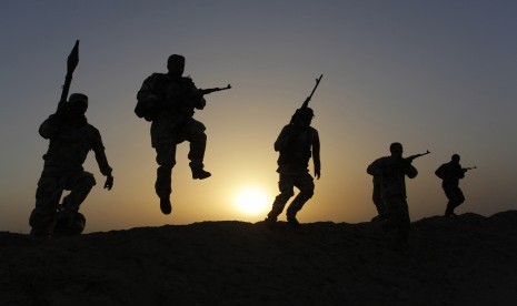 Shi'ite volunteers patrol the area as they secure it against the predominantly Sunni militants from the Islamic State, previously called the Islamic State in Iraq and the Levant (ISIL), in the desert region between Kerbala and Najaf, south of Baghdad, July