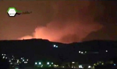 Smoke and fire fill the the skyline over Damascus, Syria, early Sunday, May 5, 2013 after an Israeli airstrike. 