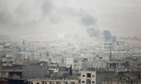 Smoke rises from the Syrian town of Kobani, on Oct, 17, 2014.