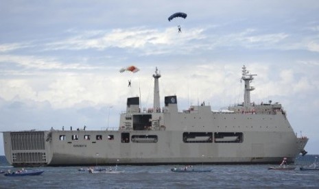 Some paramotor athletes practice before landing on Indonesian warship during preparation for the peak of Sail Raja Ampat in West Papua, Friday. 