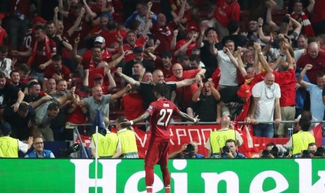  Striker Liverpool Divock Origi mencetak gol penentu kemenangan 2-0 atas Tottenham Hotspur dalam final Liga Champions, di Madrid, Ahad (2/6) dini hari WIB.