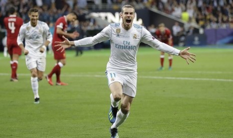 Striker Real Madrid Gareth Bale mengekspresikan kegembiraan usai mencetak gol ke gawang Liverpool di pertandingan final Liga Champions, Ahad (27/5) WIB dini hari di Olimpiyskiy Stadium, Kiev, Ukraina. 