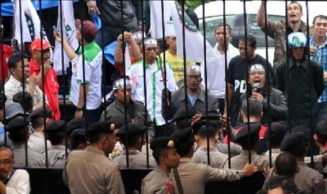 Supporters of small parties hold a protest in front of General Elections Commission's office in jakarta, over its decision over political parties that fail to fulfill the eligibility requirements.  