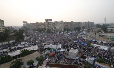 Supporters of the ousted President Mohammed Mursi shout slogans in Nasr City, asuburb of Cairo, Egypt, Monday, July 8, 2013. 