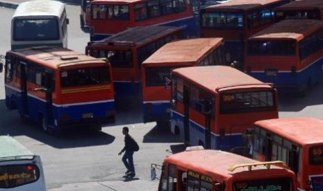 Some buses park in a bus station in Jakarta. The high of inflation was due to higher transportation fares which are contrary to initial expectation. (illustration)