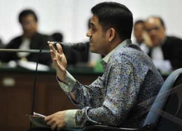 Terdakwa kasus dugaan suap wisma atlet SEA Games, Muhammad Nazaruddin, menjalani sidang dengan agenda mendengarkan jawaban penuntut umum atas eksepsi Nazaruddin di Pengadilan Khusus Tindak Pidana Korupsi (Tipikor), Jakarta, Rabu (14/12).