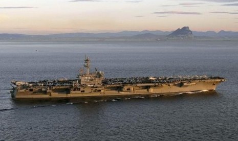 The aircraft carrier USS George HW Bush transits the Strait of Gibraltar into the Mediterranean Sea in this February 27, 2014 picture provided by the US Navy.