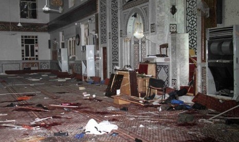 the Eman Mosque is seen destroyed after a suicide bomber blew himself up, killing Sheikh Mohammad Said Ramadan al-Buti, an 84-year-old cleric in Damascus, Syria, Thursday, March 21, 2013.