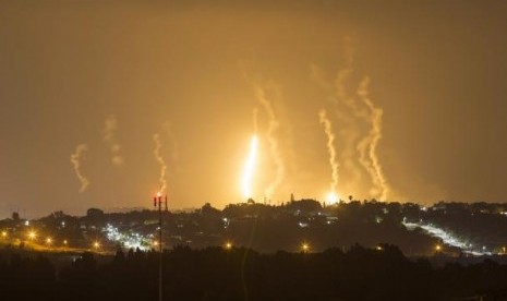 The Israeli community of Netiv Haasara is seen in front of flares fired by the Israeli army in Gaza July 23, 2014. 