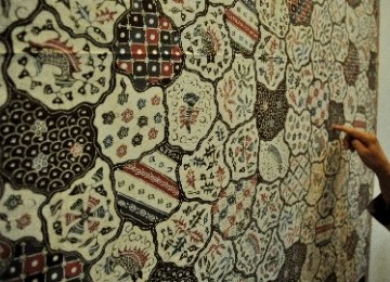 The patterns in batik represents many aspects of Indonesian culture. Batik Indramayu is on display in an exhibition (illustration).   