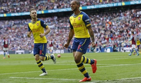 Theo Walcott melakukan selebrasi setelah mencetak gol perdana buat Arsenal di Piala FA