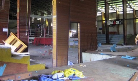 This photo shows the interior of a stadium where more than a dozen of people were killed in a stampede after spectators rioted to protest a local boxer's loss, in Nabire, Papua province, Indonesia, Monday, July 15, 2013. 