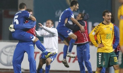 Timnas Bosnia merayakan kelolosan ke Piala Dunia untuk kali pertama.