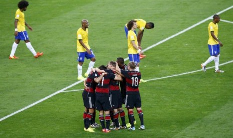 Timnas Jerman melakukan selebrasi usai mengalahkan Brasil di semifinal Piala Dunia 2014 pada Selasa (8/7).