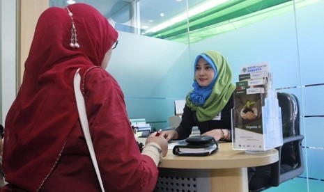 Transaction in an islamic banking in Bekasi, West Java. (illustration)  