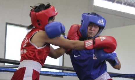 Two female boxers have a sparring match. (illustration)