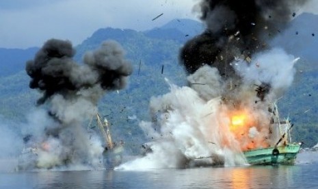 Two foreign vessels Century 4 and Century 7, explode during the sinking process by Indonesian Navy in Ambon Gulf on Sunday, December 21, 2014. 