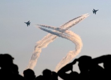 Two Sukhoi jet fighters perform in a festival in Indonesia, last year. (photo file)