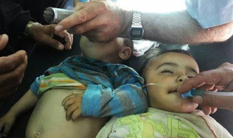 Two Syrian children receive treatment after they were given a second round of measles vaccinations, in Idlib province, Syria, this week. 