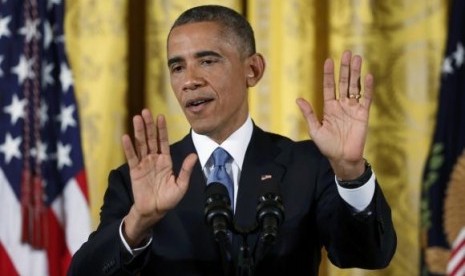 U.S. President Barack Obama answers questions during a news conference in the East Room of the White House in Washington, November 5, 2014.