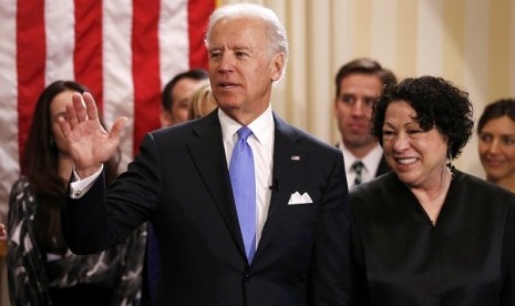 U.S. Vice President Joe Biden (left) after taking the oath of office from Supreme Court Justice Sonia Sotomayor (right) at the US Naval Observatory in Washington January 20, 2013.