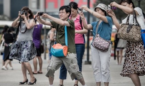 Chinese tourists. (Illustration)