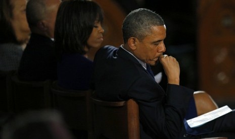 US President Barack Obama and his wife Michelle attend an inter-faith memorial service for the victims of the bombing at the Boston Marathon in Boston, Massachusetts April 18, 2013. 