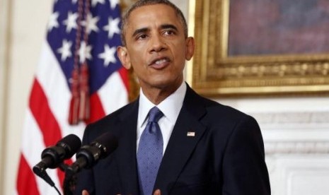 US President Barack Obama talks about the humanitarian relief situation in Iraq, at the State Dining Room of the White House in Washington August 7, 2014.