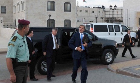 US Secreatry of State John F Kerry steps out of a vehicle as he prepares to depart from a meeting with Palestinian President Mahmoud Abbas on Friday in Ramallah, West Bank. 