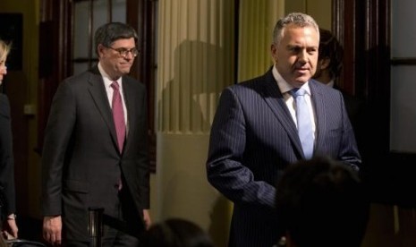 US Treasury Secretary Jack Lew and Australian Treasurer Joe Hockey (right) walk from a joint news conference at the G20 Finance Ministers meeting in Sydney, February 21, 2014.