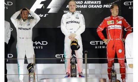 Valtteri Bottas (tengah) menjuarai GP F1 Abu Dhabi di Yas Marina, Ahad (26/11).