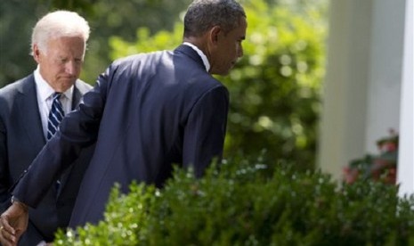 Vice President Joe Biden, left, follows President Barack Obama as he leaves the Rose Garden after making a statement about the crisis in Syria at the White House in Washington Saturday, Aug. 31, 2013 in Washington. 