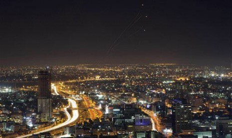 View of central Israel seen from Tel Aviv as an Iron Dome air defense system fires to intercept a rocket from the Gaza Strip, Israel, Thursday, July 10, 2014.