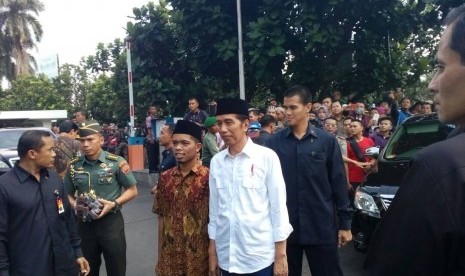 President Joko Widodo (white shirt)