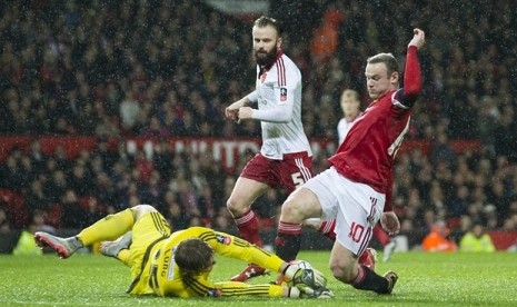 Wayne Rooney gagal menciptakan gol saat MU menghadapi Sheffield di lanjutan Piala FA, Ahad (10/1)