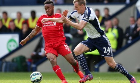 West Brom's Darren Fletcher in action with Liverpool's Raheem Sterling