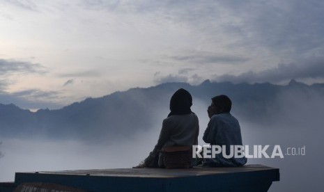 Tourists enjoying view at of Punthuk Setumbu, Borobudur, Magelang, Central Java in the morning.