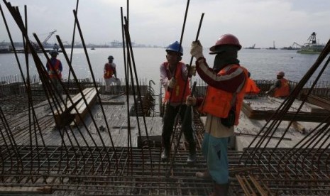 Workers toil at the construction site of a new pier. (illustration)