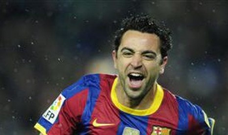 Xavi Hernandez saat masih berposisi sebagai pemain Barcelona.