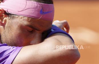 Rafael Nadal of Spain wipes the sweat during the final Godo tennis tournament against Stefanos Tsitsipas of Greece in Barcelona, Spain, Sunday, April 25, 2021. 
