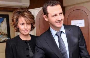 Presiden Suriah Bashar Al-Assad (kanan) dan istrinya Asma Al-Assad (kiri).