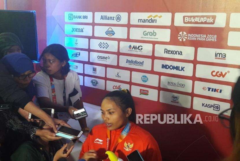 Paralifter Indonesia Ni Nengah Widiasih meraih medali perak pada nomor angkat berat 41 kilogram putri Asian Para Games 2018.