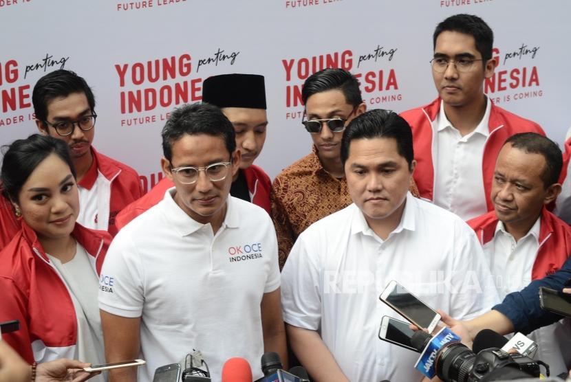   Ketua Tim Kampanye Nasional Jokowi-Ma'ruf, Erick Thohir bertemu dengan Sandiaga Uno yang merupakan mantan Cawapres RI pendamping Prabowo Subianto pada acara Young Penting Indonesia di Kemang, Jakarta Selatan, Sabtu (13/7).